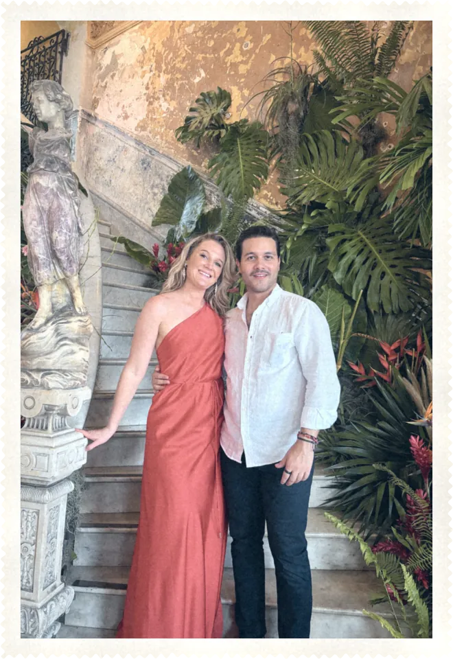 Katie and Carlos on a grand staircase